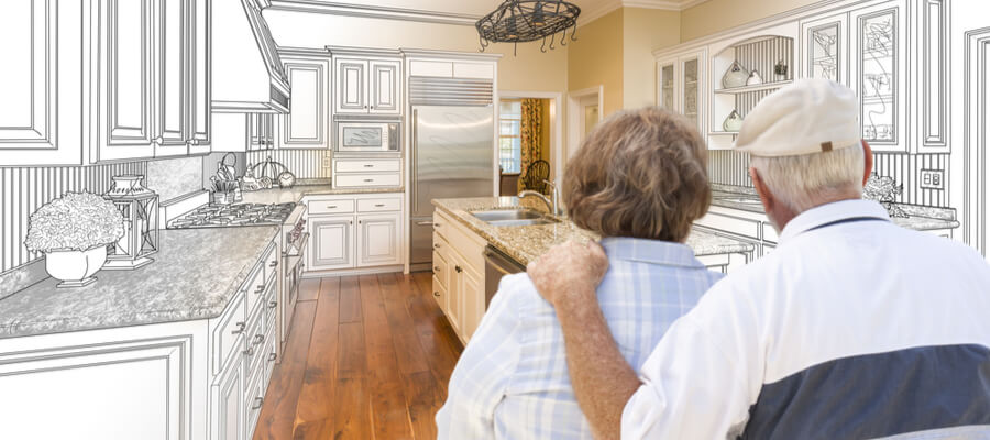 Couple reviewing kitchen renovation plans — Mississauga, ON